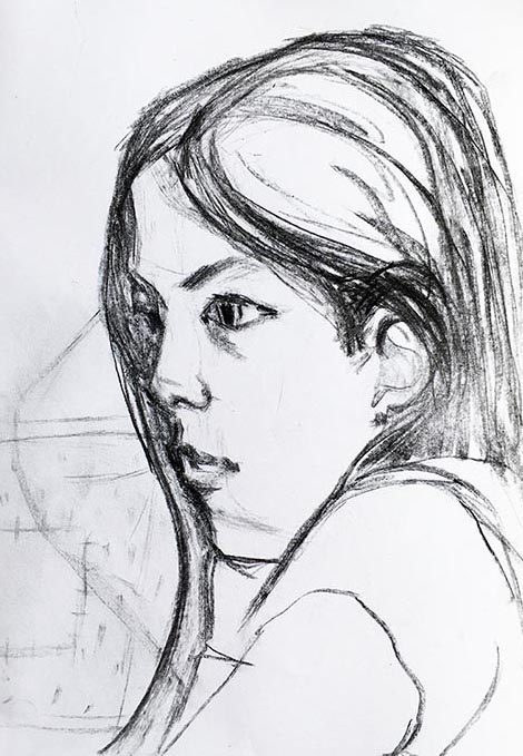 A portrait format drawing of a child in charcoal on paper, by Nina Packer. The drawing is a close up of her head, she is facing our left, watching Worzel Gummidge on T.V. The charcoal is home made using willow, this drawing is from the first National Lockdown.